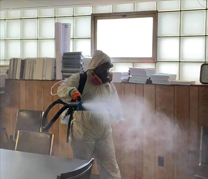 image of SERVPRO worker fogging a commercial building with a hospital grade disinfectant